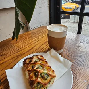 a plate of food and a cup of coffee