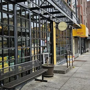 a bench in front of a restaurant