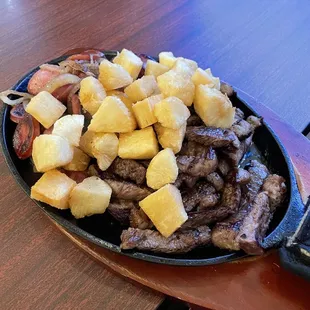 Picanha and sausage with fried yuca