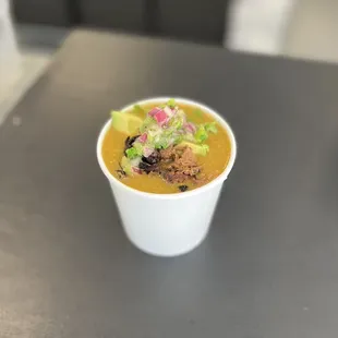 a cup of soup on a table