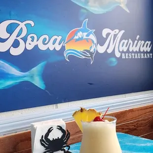 a tropical drink with a pineapple garnish