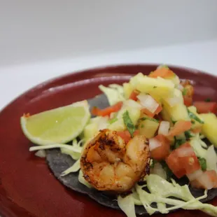 a plate of food with shrimp and vegetables