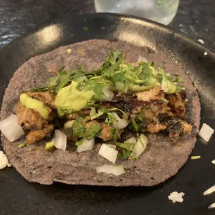 a tortilla with meat and vegetables