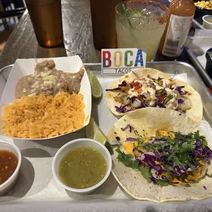 Baja Shrimp taco (top right) and Bang Bang fish (bottom). Mexican rice and beans.