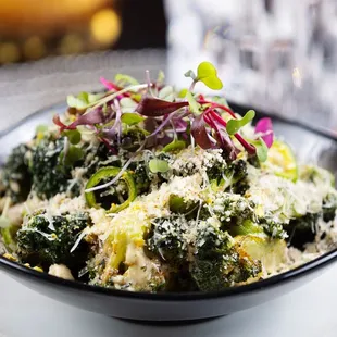 a bowl of broccoli and cheese