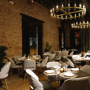 a dining room with tables and chairs