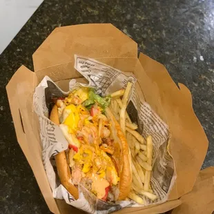 Lost Island (shrimp, imitation crabmeat, pico de gallo, cheese, chipotle sauce) with crispy fries