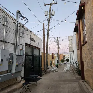 The alleyway leads directly off of Southmain. Love the lights and really sets the ambiance.