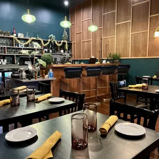 Part of the main dining room, including the bar.