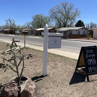 a sign for bock burger open