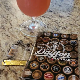 Strawberry rhubarb beer, letter E Tagabrew, and Dayton ale trail stamp