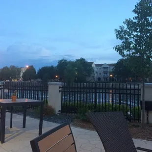 a patio with tables and chairs