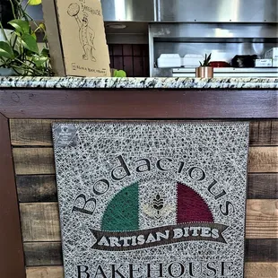This is a sign on the wall in front of the kitchen after coming in.  Photo taken May 12, 2022.