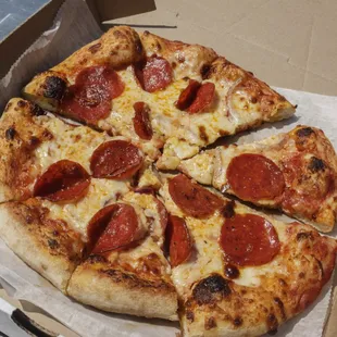 a pepperoni pizza in a box