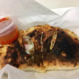 Calzone with everything they can fit in it. $9+ tip.