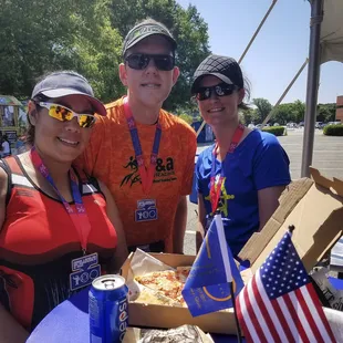 Members of The Running Turtles share Bodacious Pizza at the NASA 5K