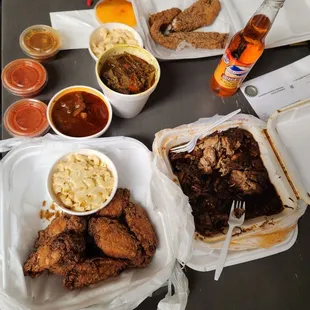 Catfish, goat curry, oxtail, jerk chicken, chicken wings, mac and cheese