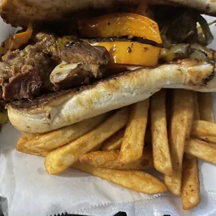 Philly cheesesteaks sandwich and fries