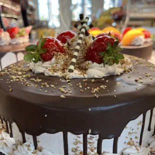 a chocolate cake with strawberries on top