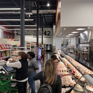 people shopping in a grocery store