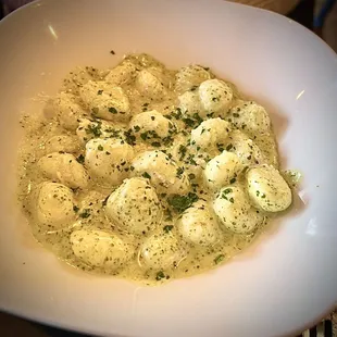 Gnocchi... tender potato dumplings poached and tossed with pesto. (This is an appetizer aka Tapas.)
