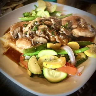 Pollo Marsala... chicken breast strips with mushrooms, garlic, marsala wine and demi-glaze over creamy griddled polenta cakes