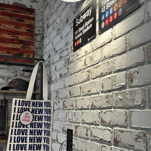 a brick wall with a sign on it