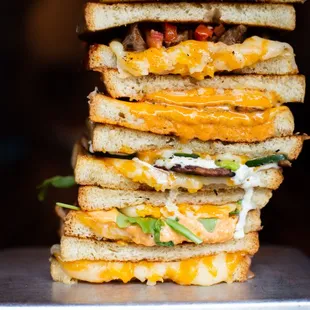 a stack of grilled cheese sandwiches