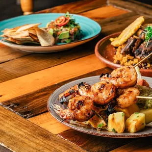 Our full order, braised oxtail, bodega crudo and grilled prawn skewers!