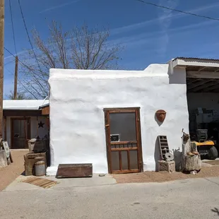 a white building with a brown door