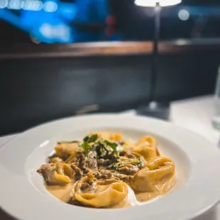 Pasta tortoloni con champiñones