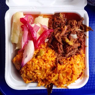 Paella, yuca, ropa vieja. 10 bucks for 2 meals worth of food. Super good.