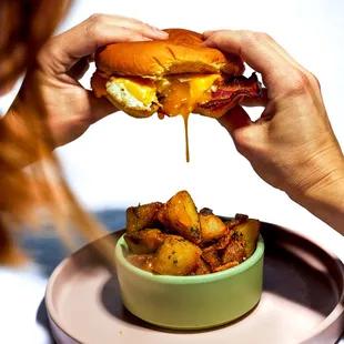 a person holding a plate of food