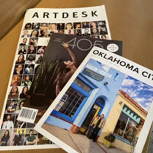 a couple of magazines on a table