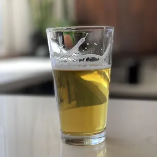 a glass of beer on a table
