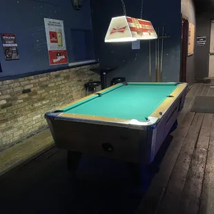 a pool table in a basement
