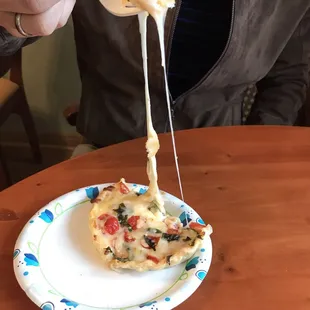 The melted cheese as you cut into the pie