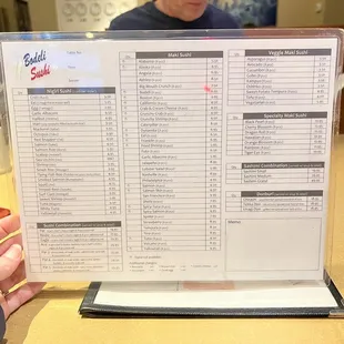 a person holding a menu