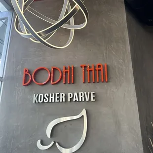 Pretty wall sign behind front desk