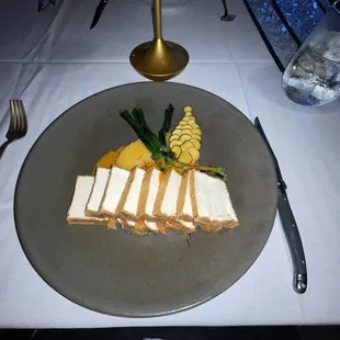 Tofu version of the filet mignon, roasted carrots, rutabaga purée, grilled garlic chive blossoms with yellow curry sauce