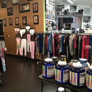 clothing racks and tables in a clothing store