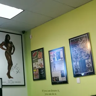 Posters of Iris Kyle and Hide Yamagishi, co-owners and professional bodybuilders, adorn the walls.