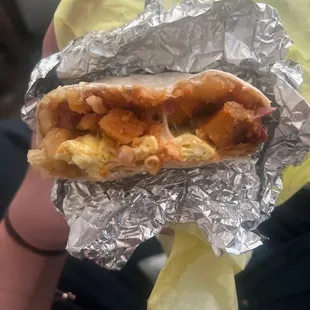 Bacon breakfast burrito with hot sauce- HUGE!