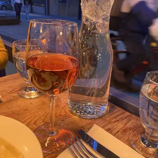 a plate of food and a glass of wine