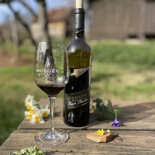 a glass of wine and a bottle of wine