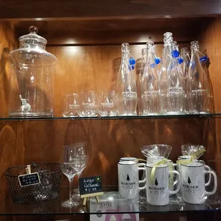 a display of wine glasses and pitchers