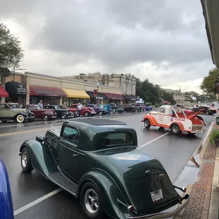 Antique cars parked on Main Street outside Boerne Grill.