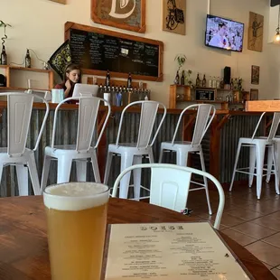 a glass of beer on a table
