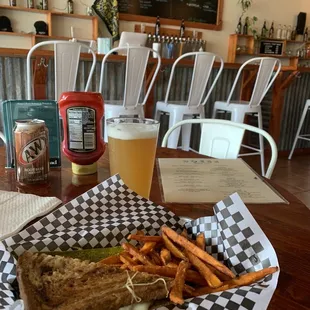 a sandwich and fries on a table