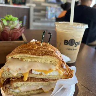 Croissant egg cheese bacon sando and iced white mocha